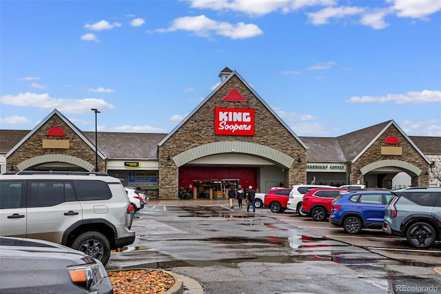 view of commercial location featuring uncovered parking