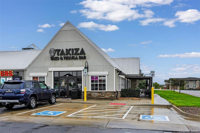 view of commercial location featuring uncovered parking