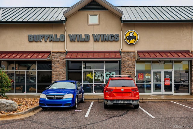 view of commercial property featuring uncovered parking