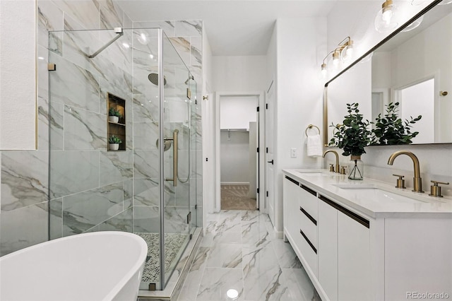 full bath with a freestanding bath, a stall shower, double vanity, marble finish flooring, and a walk in closet