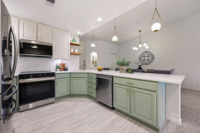 kitchen featuring stainless steel appliances, green cabinets, a peninsula, a sink, and light countertops