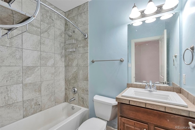 bathroom with toilet, shower / bathtub combination, and vanity