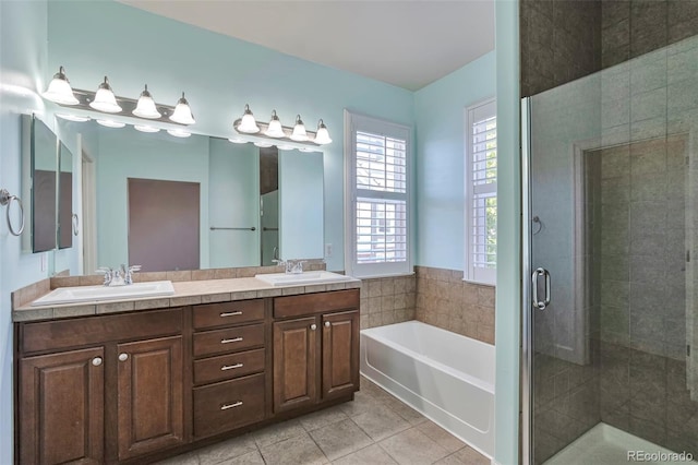full bath featuring a shower stall, a bath, tile patterned floors, and double vanity