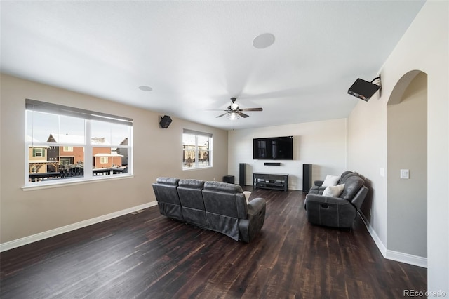 living room with dark hardwood / wood-style floors and ceiling fan