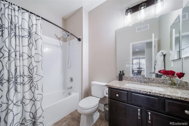 full bathroom featuring shower / tub combo with curtain, vanity, tile patterned floors, and toilet