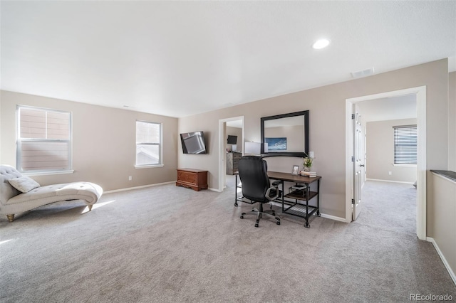 home office with light colored carpet