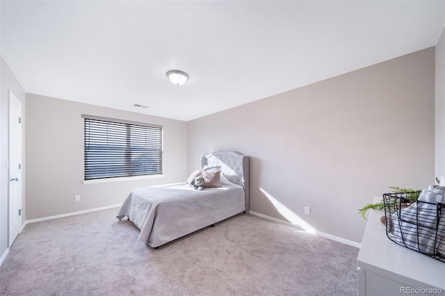 bedroom with light colored carpet