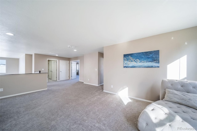 unfurnished living room with light carpet