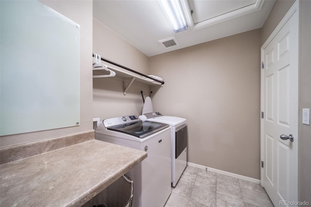 laundry room with washer and clothes dryer