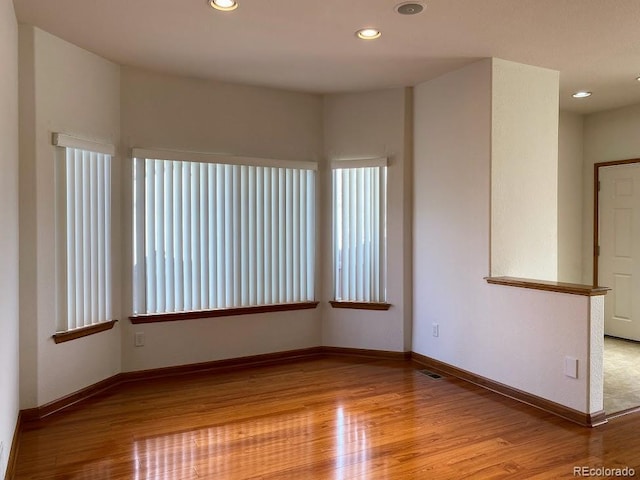 1022 Morning Dove Dr, Longmont, CO 80504 - empty room with wood finished floors, recessed lighting, and baseboards