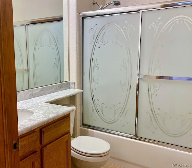 1022 Morning Dove Dr, Longmont, CO 80504 - bathroom with bath / shower combo with glass door, vanity, and toilet