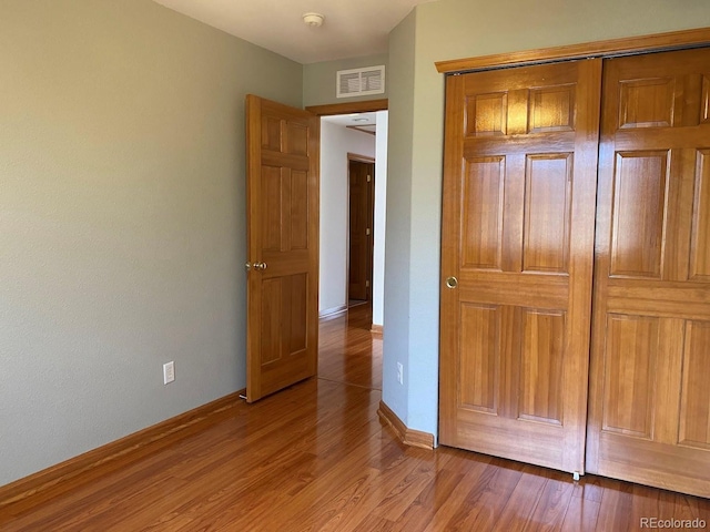 1022 Morning Dove Dr, Longmont, CO 80504 - unfurnished bedroom with light wood-style flooring, baseboards, and a closet