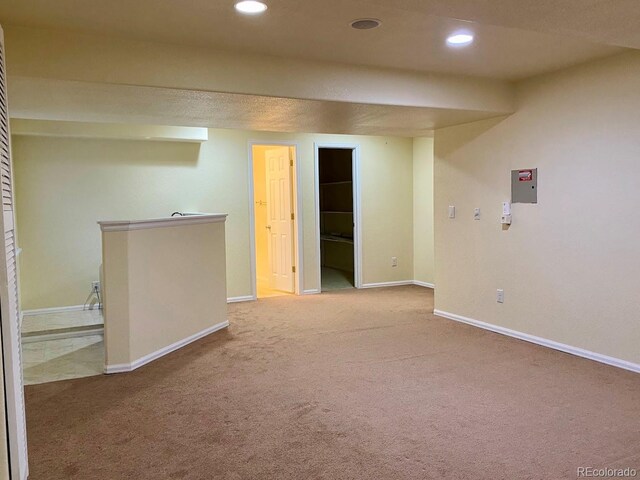 1022 Morning Dove Dr, Longmont, CO 80504 - finished below grade area with carpet flooring, baseboards, recessed lighting, and electric panel