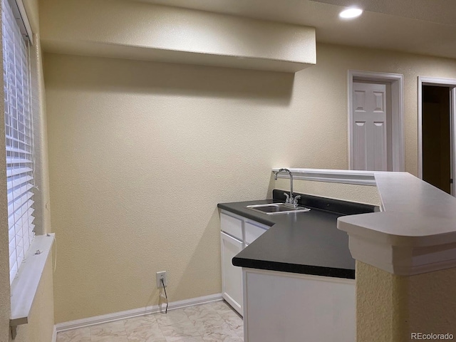 1022 Morning Dove Dr, Longmont, CO 80504 - bar with a sink, light marble finish flooring, baseboards, and recessed lighting