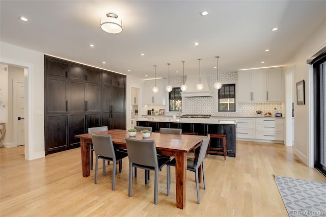 dining room with light hardwood / wood-style flooring