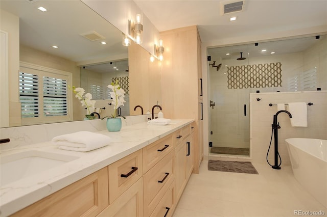 bathroom featuring vanity, tile patterned floors, and separate shower and tub