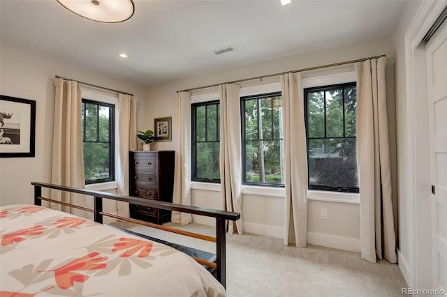 bedroom featuring light colored carpet