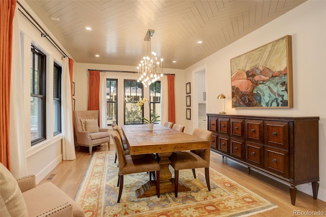 dining room featuring a chandelier and light hardwood / wood-style flooring