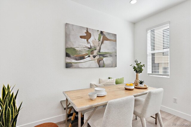 5128 W 26th Ave Unit 101, Denver, CO 80212 - dining area featuring wood finished floors and baseboards