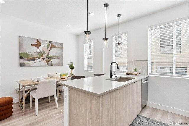5128 W 26th Ave Unit 101, Denver, CO 80212 - kitchen featuring plenty of natural light, modern cabinets, light countertops, and a sink