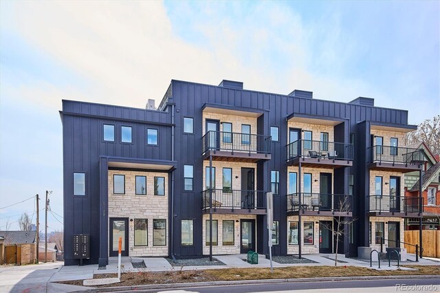 5128 W 26th Ave Unit 101, Denver, CO 80212 - exterior space featuring board and batten siding