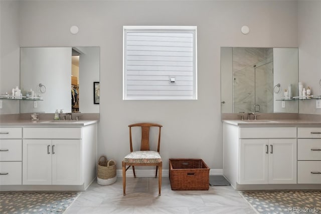 full bathroom featuring two vanities, a sink, and a shower stall