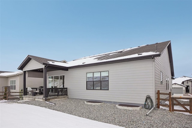 back of house with fence and a patio