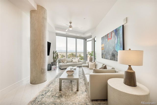 living room featuring light hardwood / wood-style floors and ceiling fan