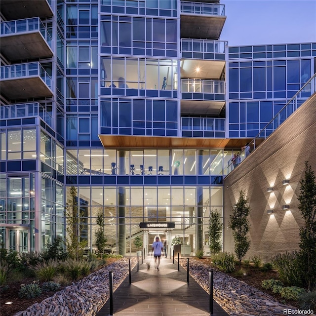 view of outdoor building at dusk