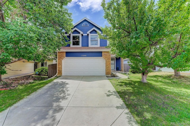 view of front of home with a garage and a front yard