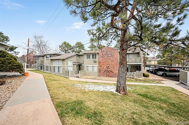 exterior space featuring a yard and a residential view
