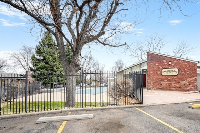 view of gate featuring fence