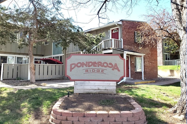 community sign featuring fence