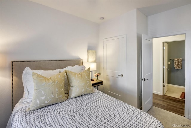 carpeted bedroom with a closet