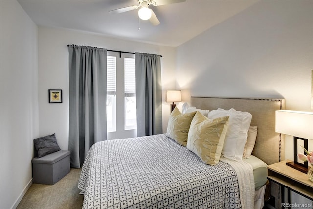 bedroom featuring ceiling fan and light colored carpet