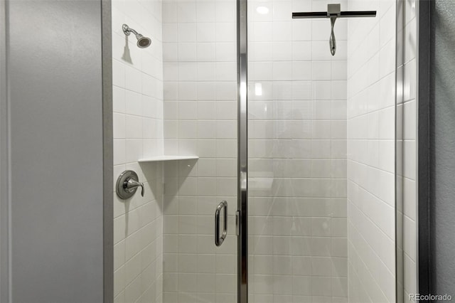 interior details featuring an enclosed shower