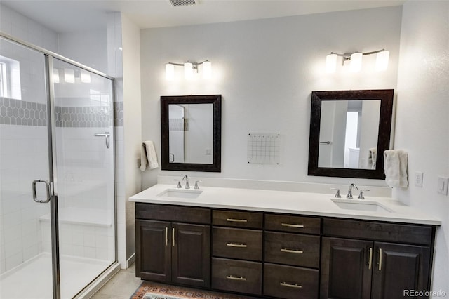 bathroom with an enclosed shower and vanity