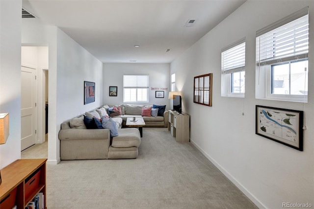 living room featuring light carpet