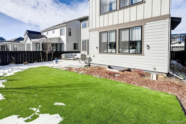 rear view of property with an outdoor hangout area, a patio, and a yard