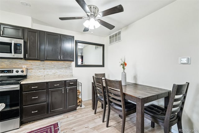 11941 Bellaire St Unit B, Thornton, CO 80233 - dining room with light wood-style floors and ceiling fan