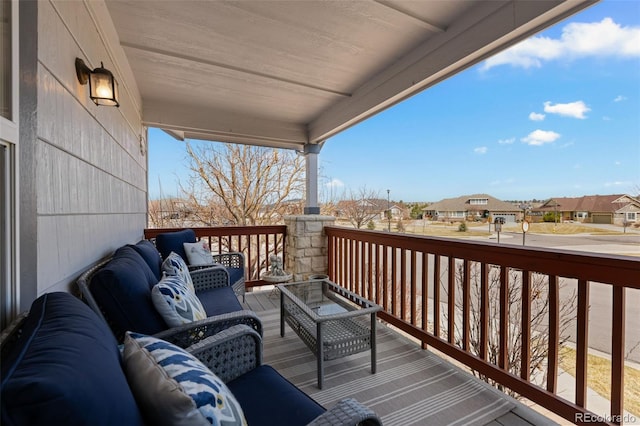 deck with an outdoor living space and a residential view