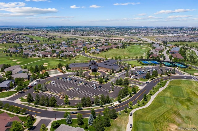 aerial view with a residential view and view of golf course