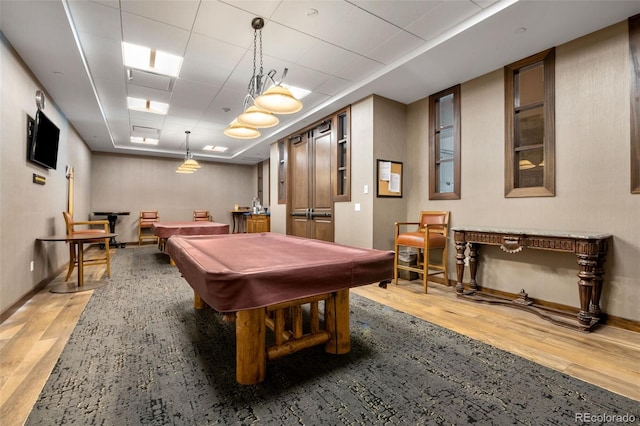 rec room with billiards, a paneled ceiling, baseboards, and light wood finished floors