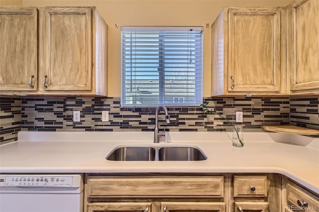 kitchen with backsplash, dishwasher, sink, and light brown cabinets