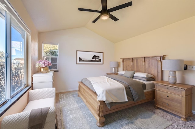 carpeted bedroom with ceiling fan and lofted ceiling