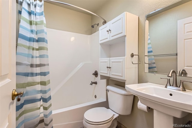 full bathroom with toilet, shower / bathtub combination with curtain, and sink