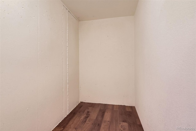 empty room featuring wood-type flooring