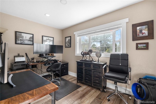 office featuring wood finished floors, baseboards, and recessed lighting