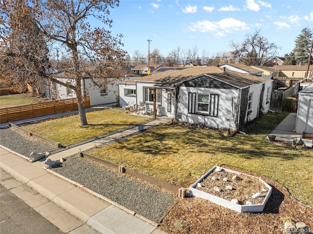 ranch-style house with a front lawn