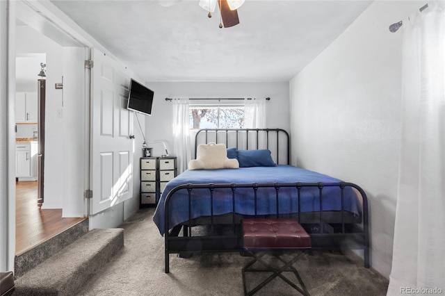 bedroom with ceiling fan and carpet flooring